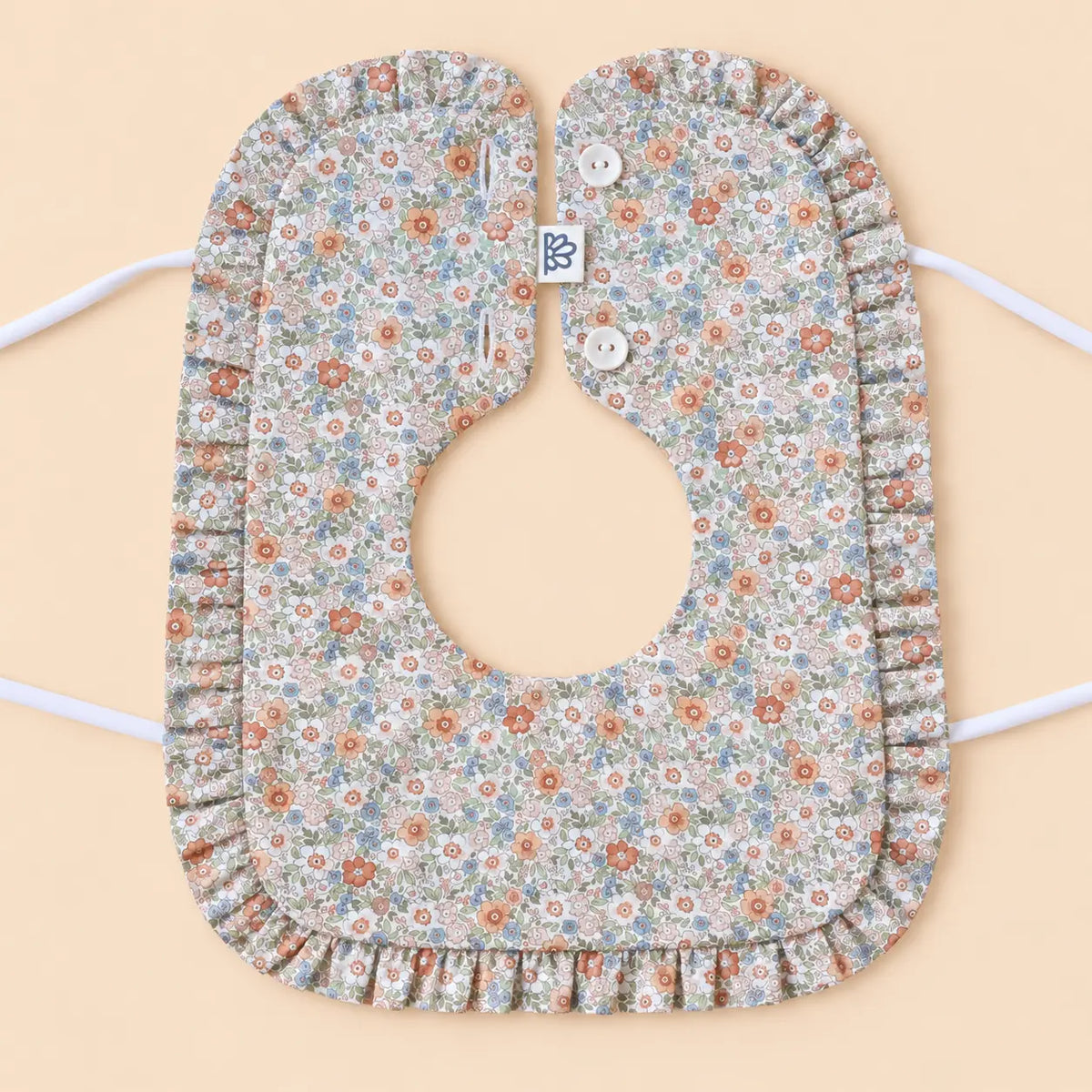 Babero con volante Volterra coral | BAPUM