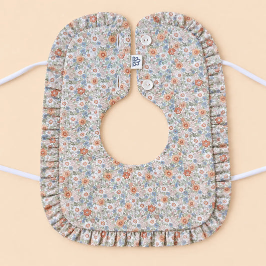 Babero con volante Volterra coral | BAPUM